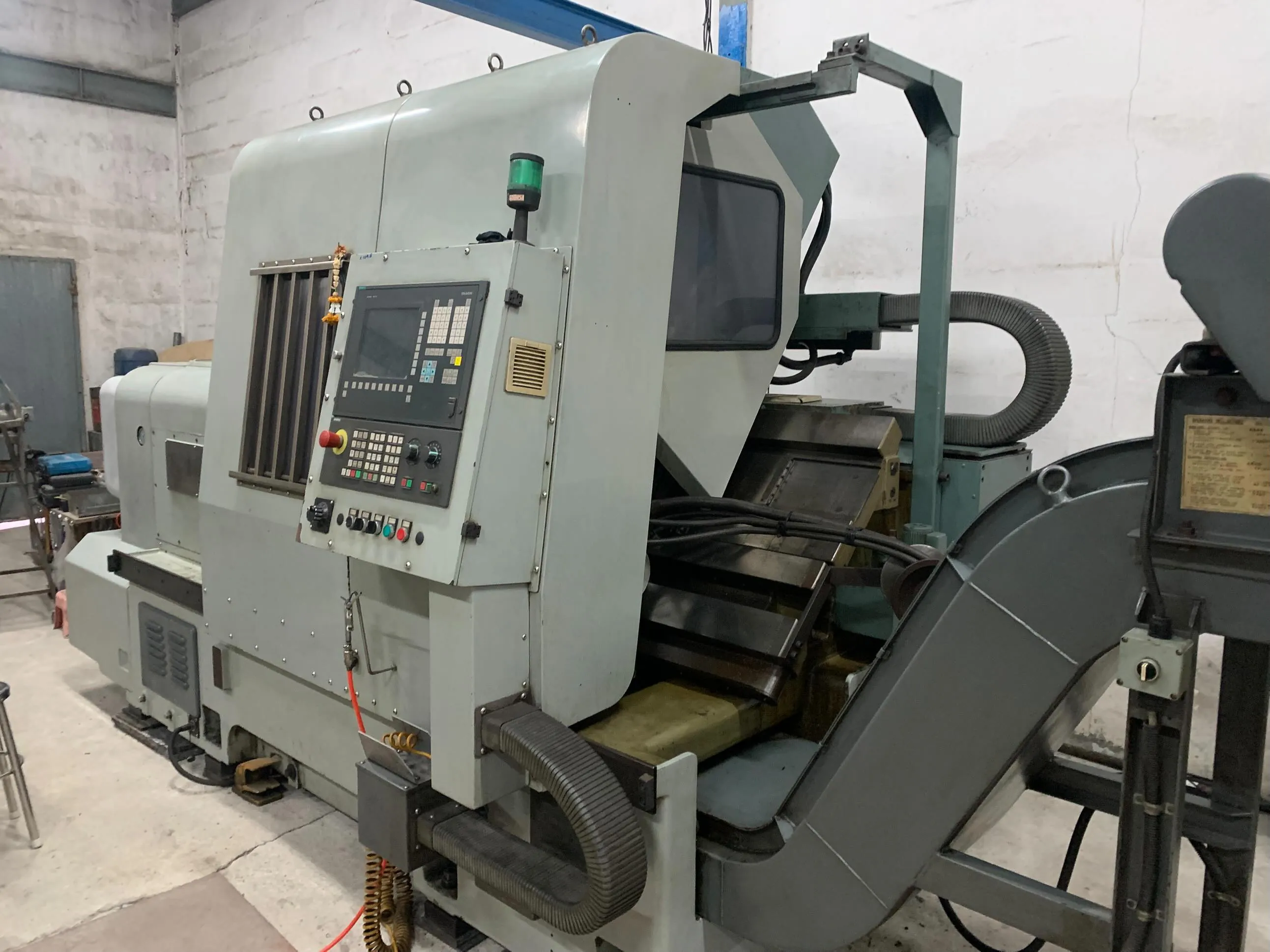 CNC turning lathe with control panel used to machine CHP custom rolling tools